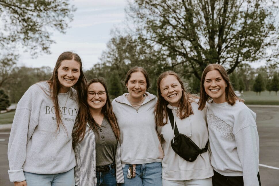 a group of girls outside for a picture